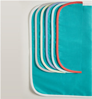 A close-up of six folded colored bedsheets, each with a different colored edge, displayed on a plain background.