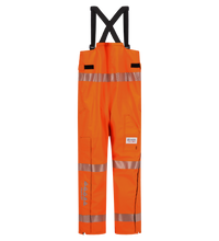 A pair of bright orange Overall, High-Visibility FR/ARC Rated, US Markings, Regular, 706F-BL from Lac-Mac, Limited with reflective strips, black shoulder straps, and multiple pockets, hanging vertically.