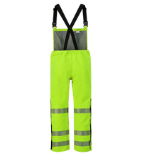 Bright high-visibility yellow safety pants with black suspenders and reflective stripes on the legs. These Lac-Mac, Limited Overall, High-Visibility, FR/ARC Rated, SAFE-T™ Style, Reflective Markings, Regular, 706FE also feature side pockets and reinforced knees for added durability.