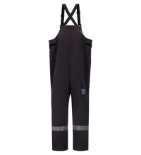 Black bib overalls with reflective stripes near the ankles and adjustable shoulder straps, viewed from the back, featuring Switch Suit Overall, 40 Cal. ARC Rated, 706K from Lac-Mac, Limited for ultimate safety and compliance with PPE Category 4 standards.