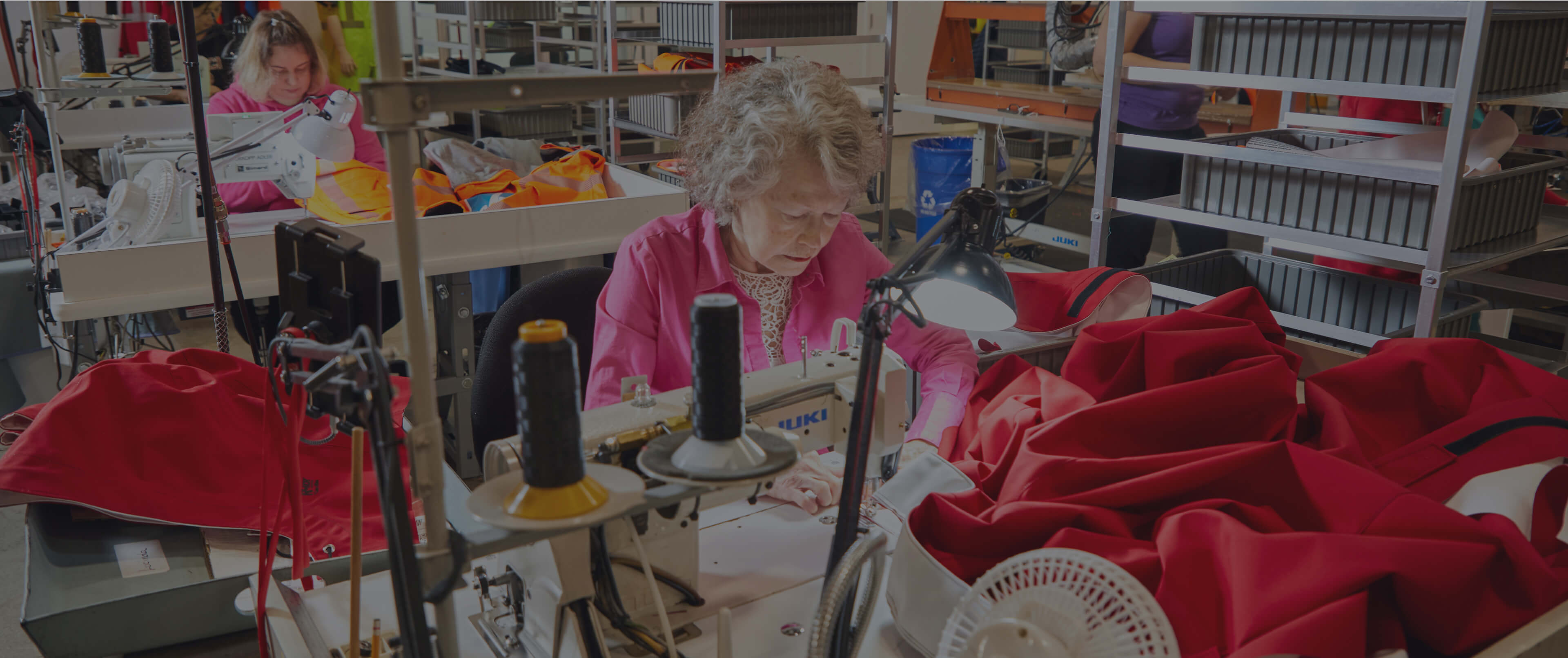 A lady is working on creating protective equipment at Lac Mac.